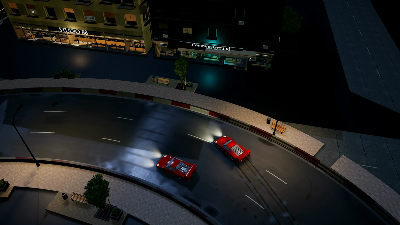 Two F40s side by side through a curve of the night city, seen from above.